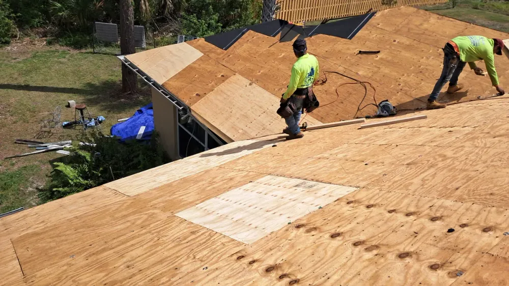 Post-storm roof inspection in progress on a Sarasota home