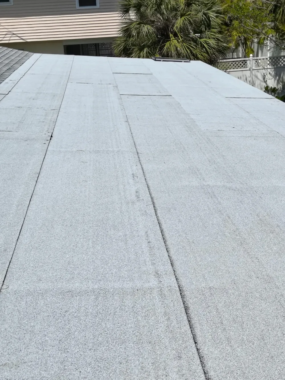 Completed modified bitumen flat roof with granular cap sheet in Sarasota, FL