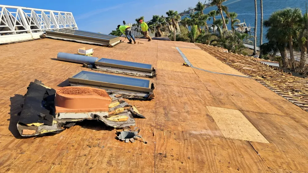 Roof over installation showing new shingle layer above existing roof in Sarasota, FL