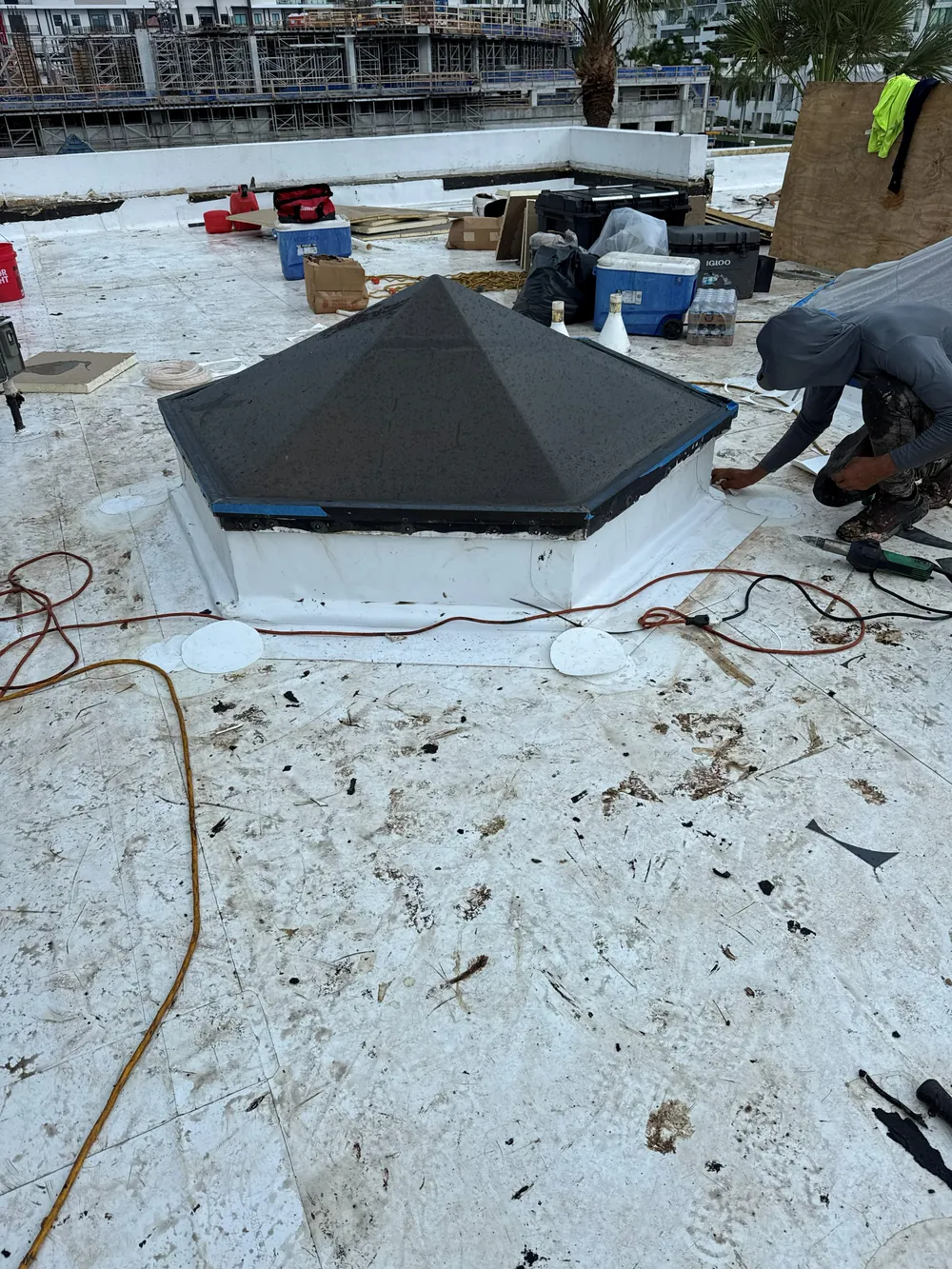 SRQ Building Services inspector performing a thorough roof inspection in Sarasota, FL