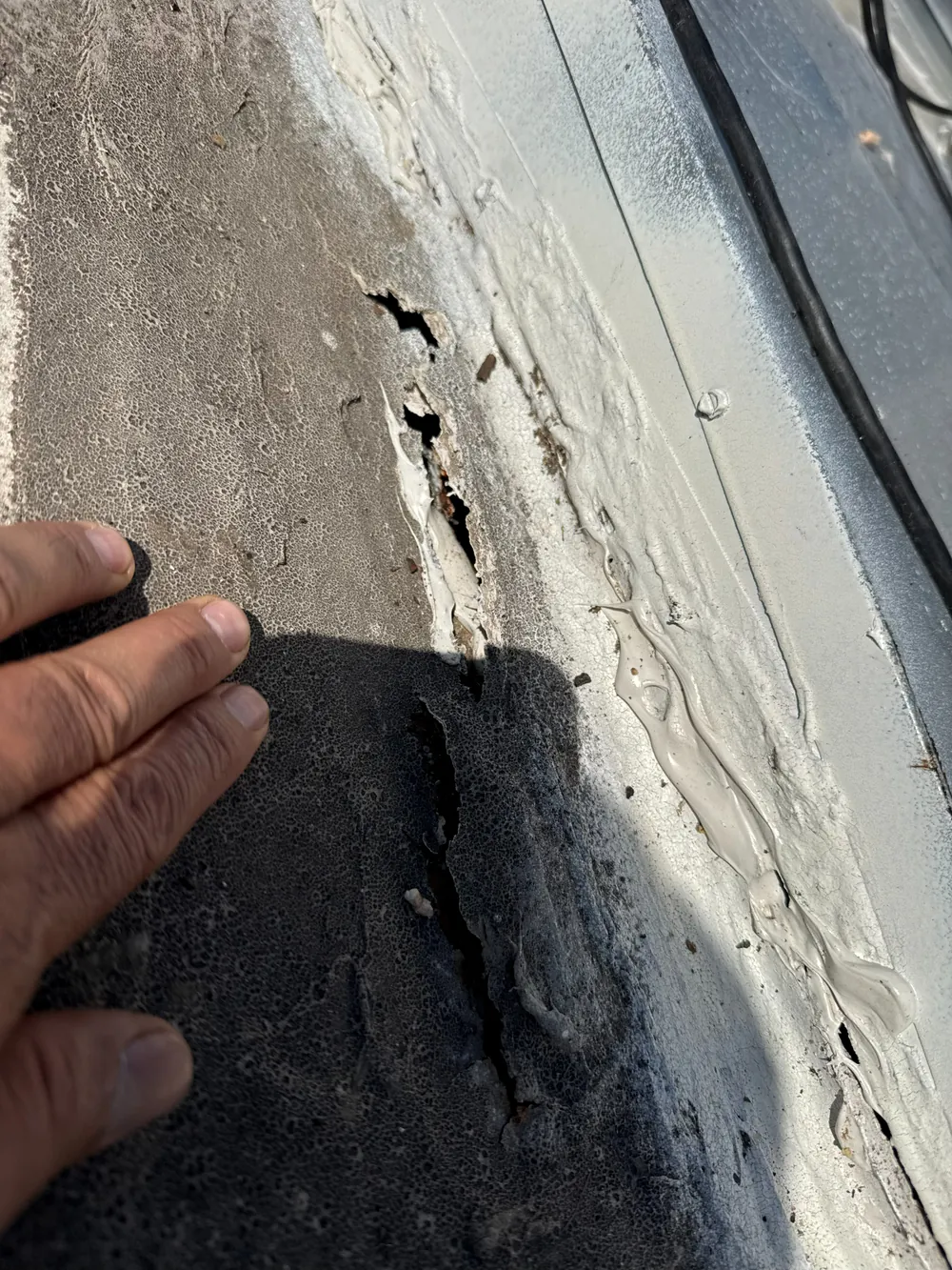 SRQ Building Services inspecting a roof after a Sarasota storm event