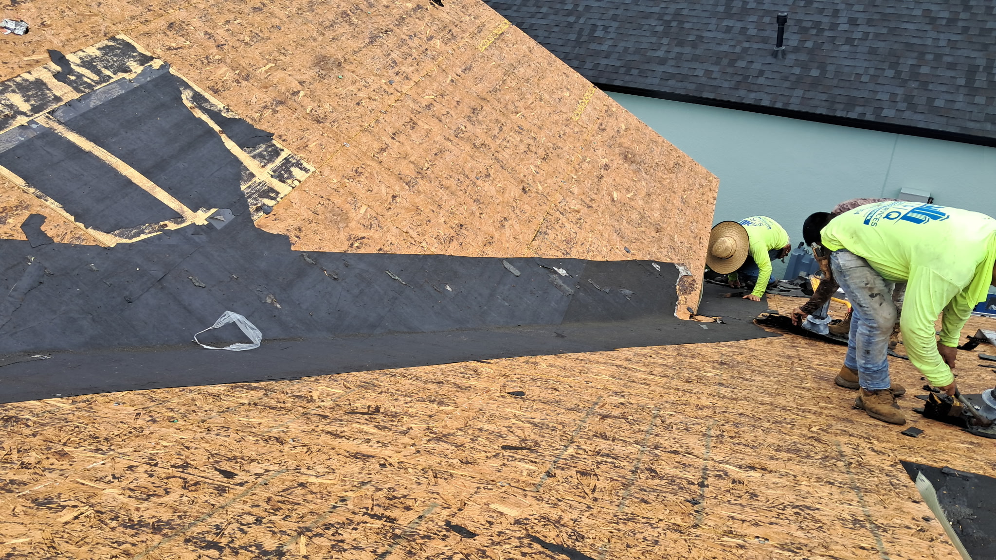 SRQ crew performing a detailed roof inspection scope walkthrough in Sarasota