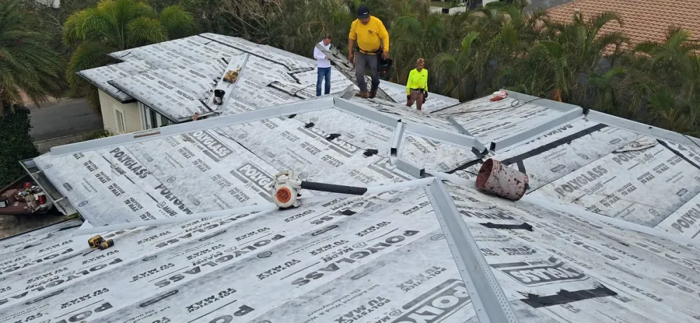 SRQ Building Services local roofing crew installing a roof on a Sarasota, FL home