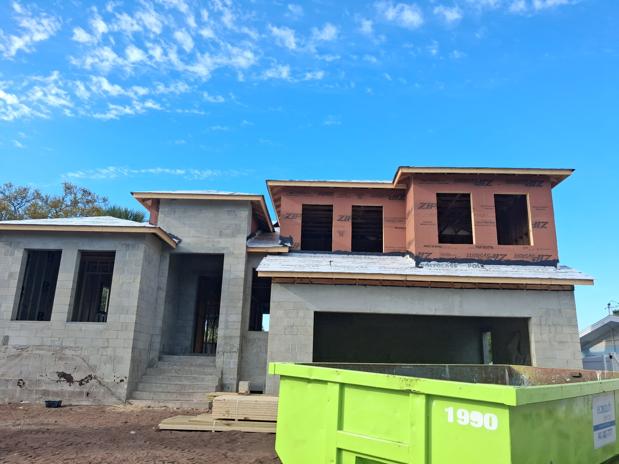 SRQ Building Services documenting roof damage details on a Sarasota home