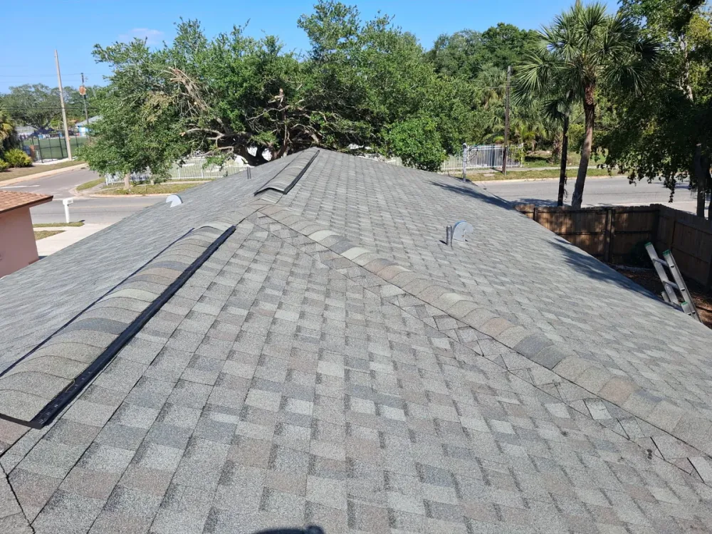 SRQ Building Services crew performing routine roof maintenance in Sarasota
