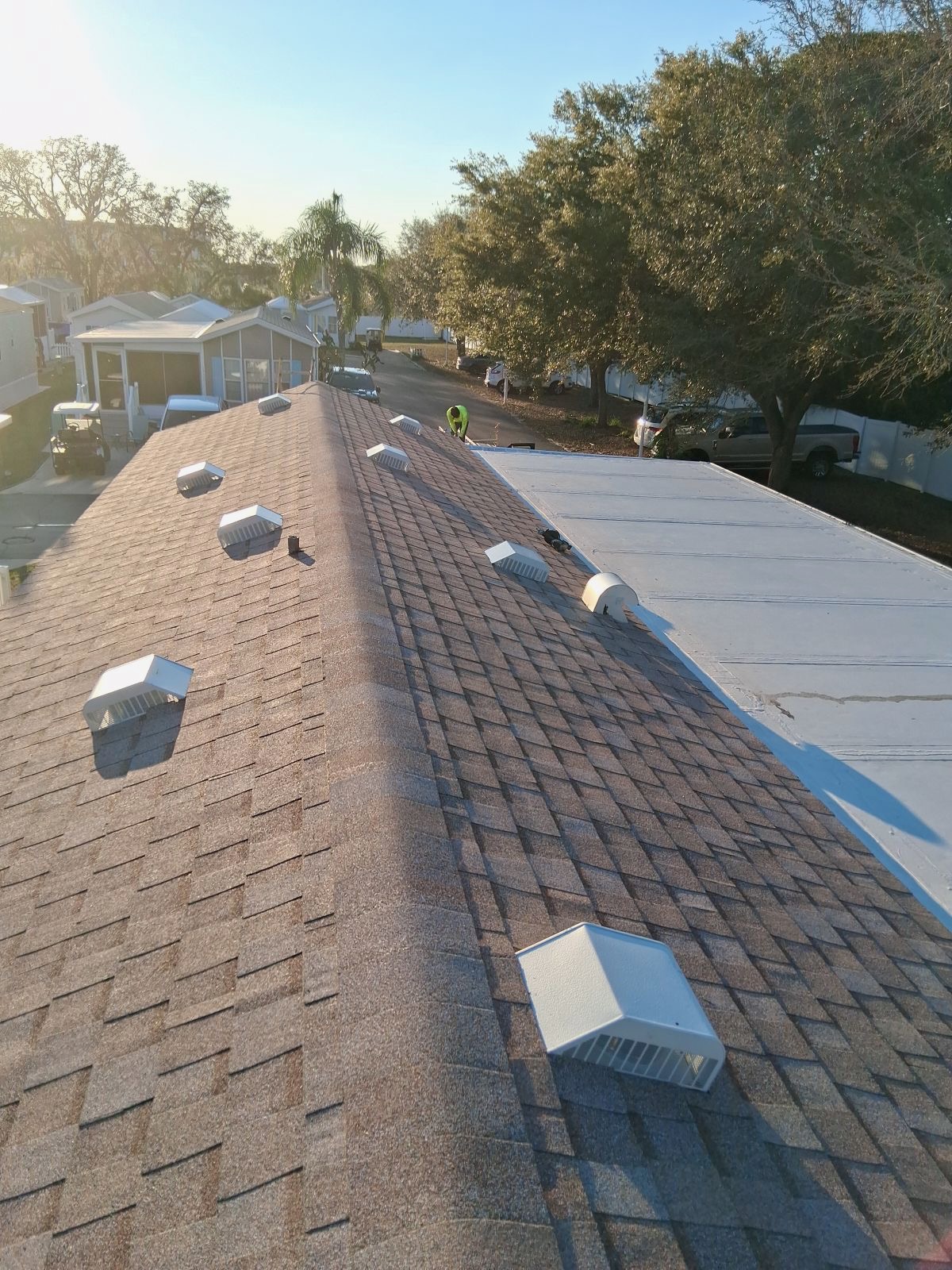 SRQ Building Services performing a roof leak diagnosis on a Sarasota home