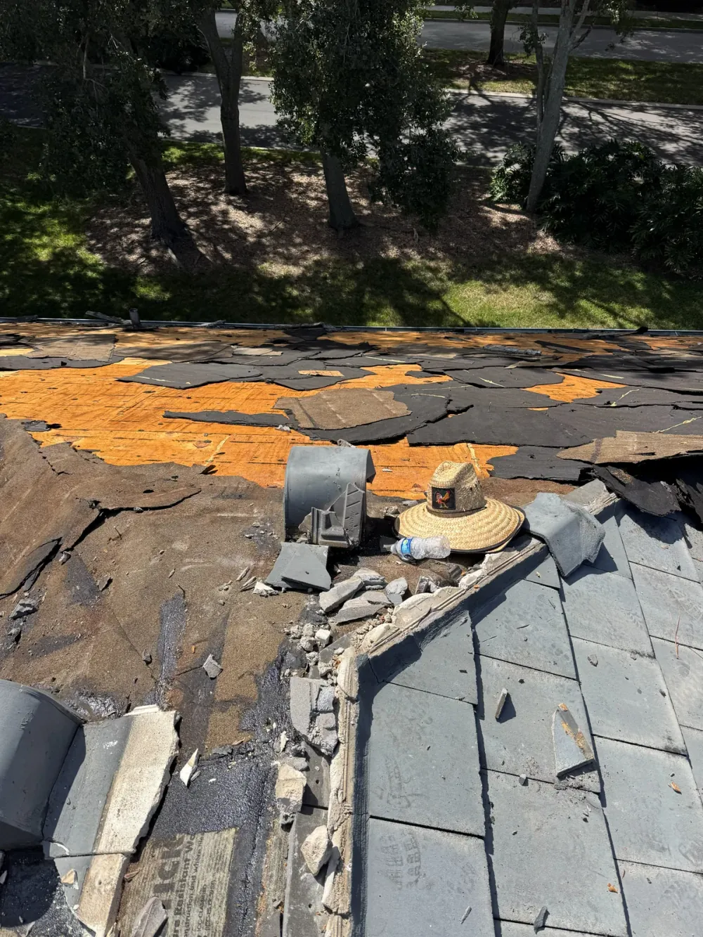 SRQ Building Services performing roof leak diagnosis on a Sarasota, FL home