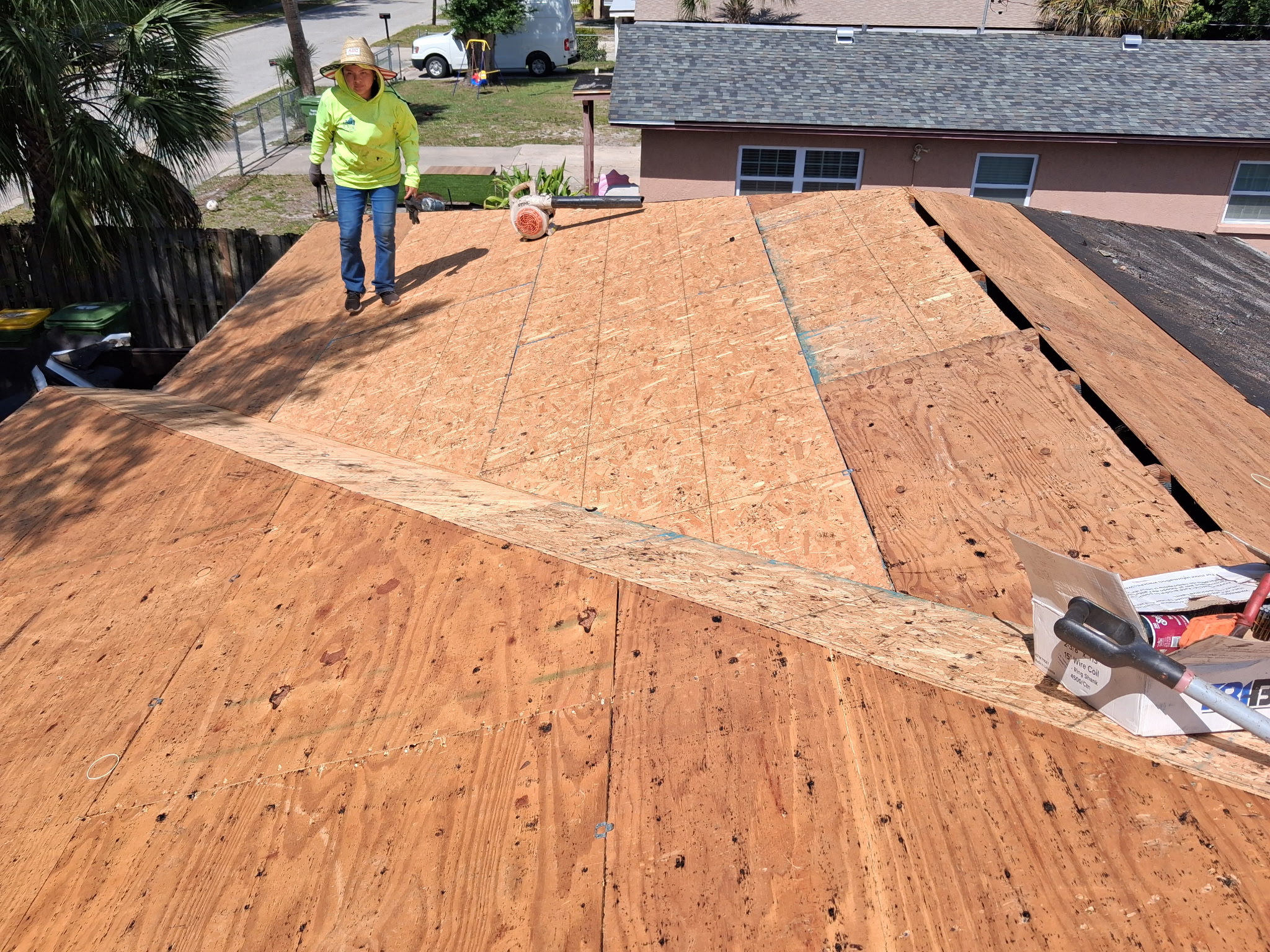 SRQ Building Services roofing crew installing a new roof in Sarasota, FL